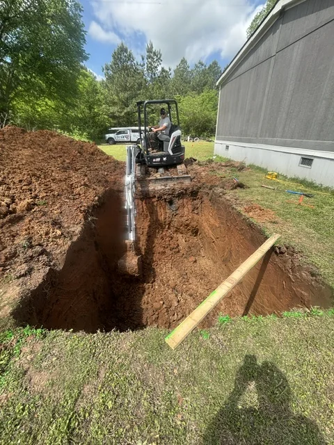 Titan Plumbing excavating for an aerobic septic system installation near Durant Oklahoma