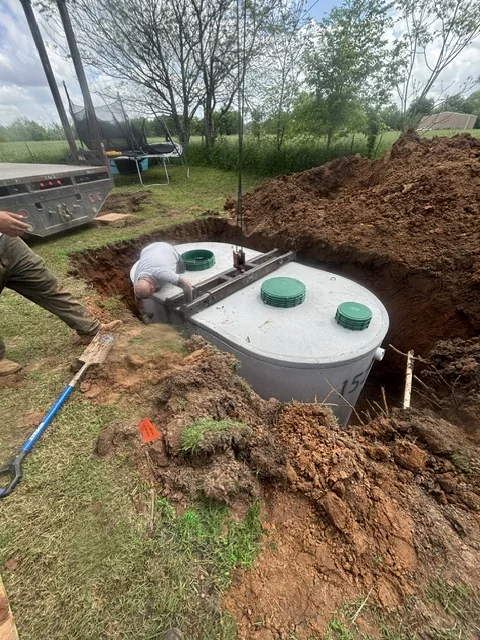 Aerobic septic treatment tank being installed by Titan Plumbing near Durant Oklahoma