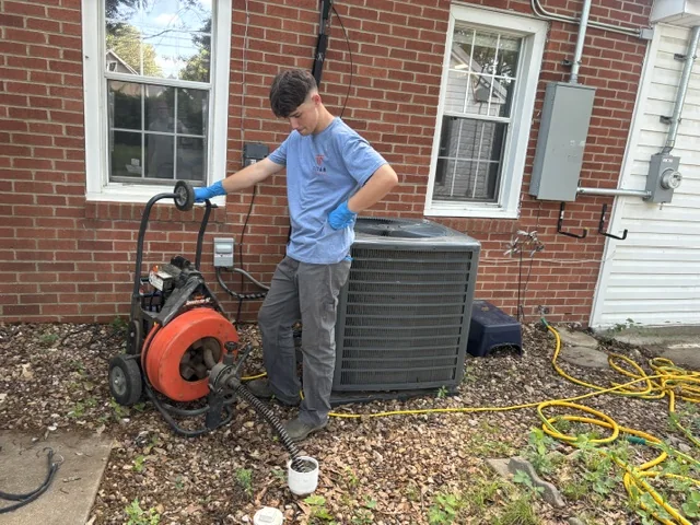 Titan Plumbing technician using professional drain-cleaning equipment in Durant Oklahoma